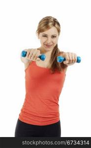 smiling fitness woman exercising with dumbbells. smiling cute fitness woman exercising with blue dumbbells on white background