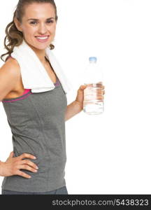 Smiling fitness young woman holding bottle of water