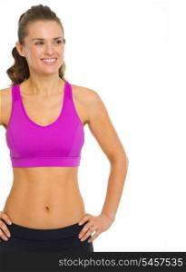 Smiling fitness young woman looking on copy space