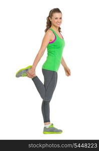 Smiling fitness young woman stretching