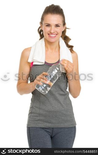 Smiling fitness young woman with towel and bottle of water