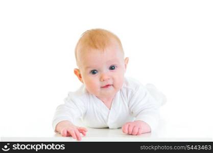 Smiling four month old baby girl laying on abdomen&#xA;