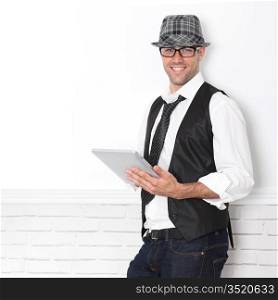 Smiling funny guy using electronic tablet