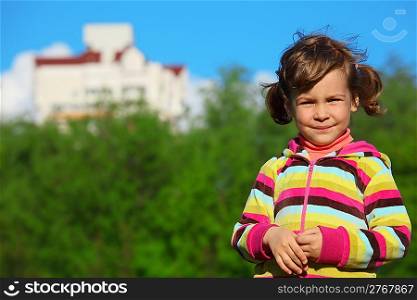 smiling girl at field against the home