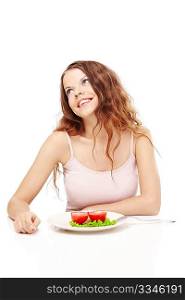 Smiling girl eats the vegetable salad, isolated