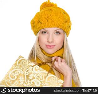 Smiling girl in autumn clothes with shopping bag