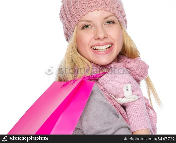 Smiling girl in winter clothes with shopping bags