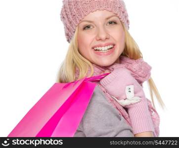 Smiling girl in winter clothes with shopping bags