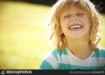 Smiling girl laughing outdoors