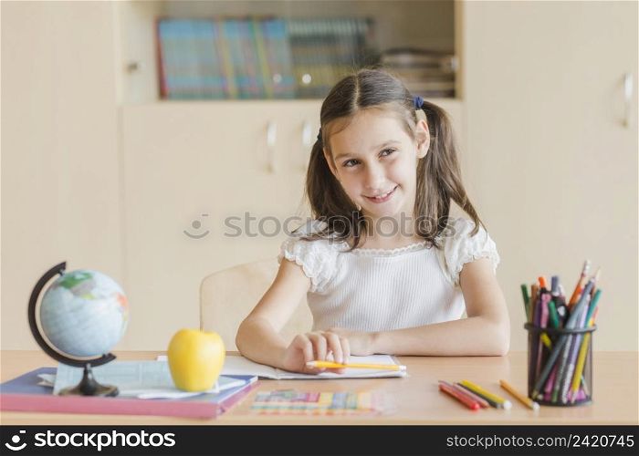 smiling girl looking away during lesson