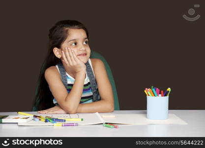 Smiling girl lost in thoughts