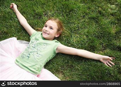 Smiling Girl Lying in the Grass