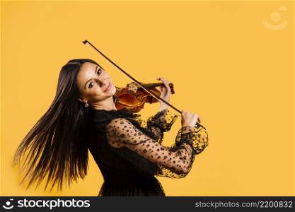 smiling girl playing violin
