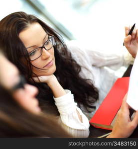 smiling girl thinking on examinination