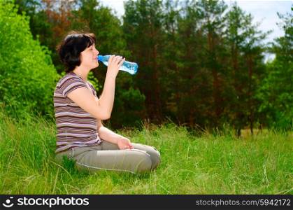 Smiling girl with a water bottle