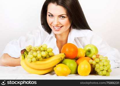 smiling girl with group of fruits