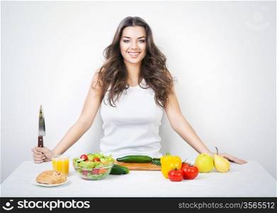 smiling girl with knife on kitchen