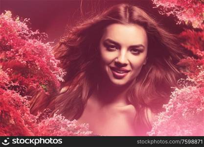 smiling girl with long hair and flowers