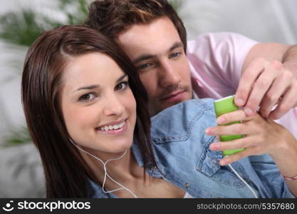 Smiling girl with mp3 player