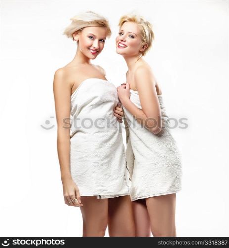 Smiling girls in towels