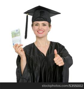 Smiling graduation student woman with pack of euros showing thumbs up. HQ photo. Not oversharpened. Not oversaturated. Smiling graduation student woman with pack of euros showing thumbs up isolated