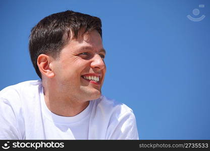 smiling guy against blue sky