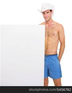 Smiling guy in hat showing blank billboard