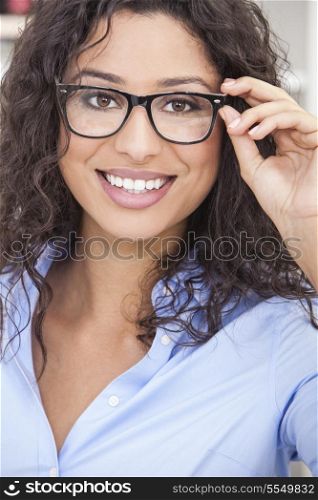 Smiling happy beautiful young woman or girl wearing geek glasses