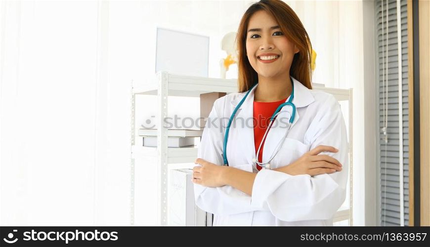 Smiling happy doctor in office