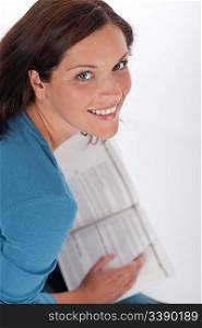 Smiling happy woman with book on white background