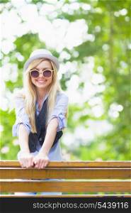Smiling hipster girl outdoors