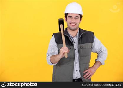 Smiling laborer on yellow background