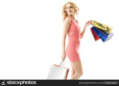 Smiling lady holding a bunch of shopping bags