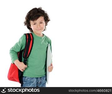 Smiling little boy with backpack and schoolbooks