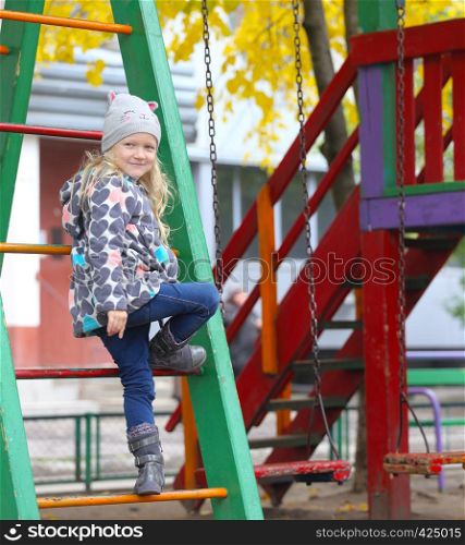 smiling little girl at the playground