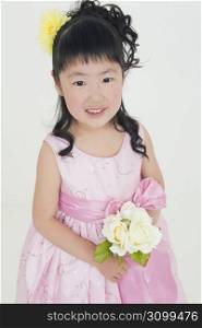 smiling little girl in pink dress