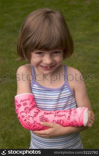 Smiling Little Girl With Cast on Her Arm