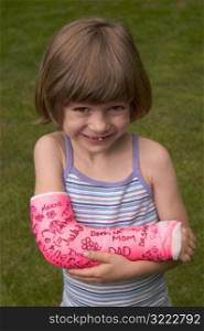 Smiling Little Girl With Cast on Her Arm