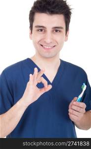 smiling male dentist closeup holding toothbrush and showing ok sign isolated on white background