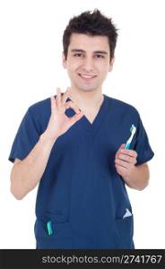 smiling male dentist holding toothbrush and showing ok sign isolated on white background