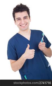 smiling male dentist holding toothbrush and showing thumb up isolated on white background