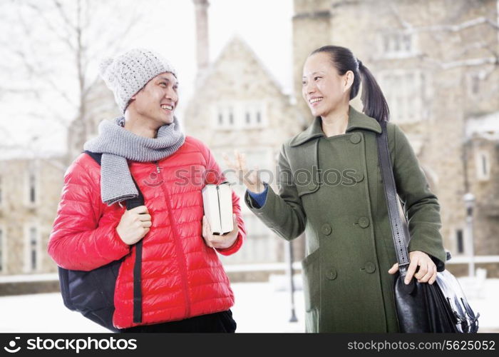 Smiling man and woman in winter clothes