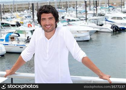 Smiling man at a marina