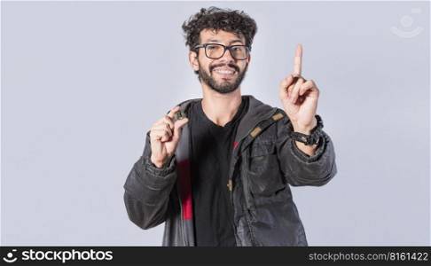 Smiling man holding bitcoin coin and lifting finger, Handsome man showing bitcoin coin, Person holding bitcoin coin isolated