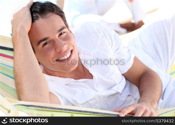 Smiling man in a hammock