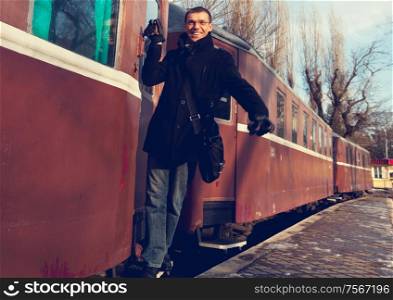 Smiling man on railroad station