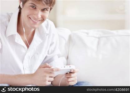 Smiling man playing on a game