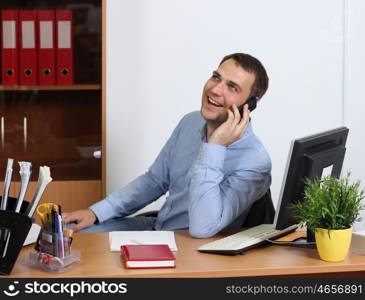 Smiling man talking on mobile phone