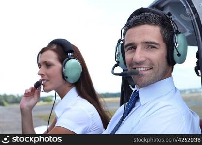 Smiling man waiting for takeoff in the cockpit of a light aircraft