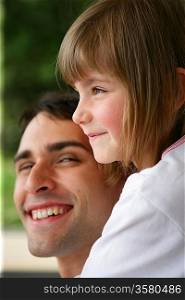 Smiling man with cute little girl